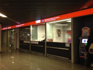 a storefront with red and white signs