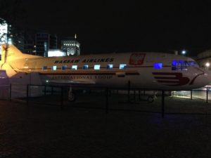 a plane on display at night