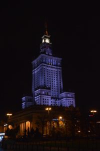 a tall building with a spire at night