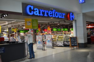 a man standing in front of a store