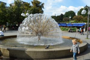 a child walking in a fountain