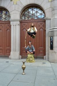 a statue of a man jumping in the air