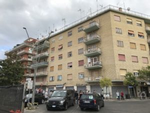 a building with cars parked in front of it