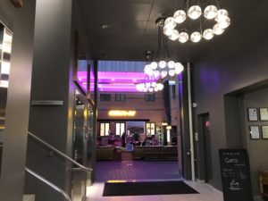 a hallway with lights from the ceiling