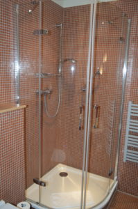 a shower with glass doors