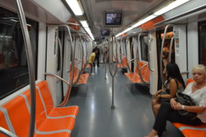 a subway train with orange seats