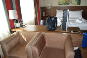 a room with a television and a chair