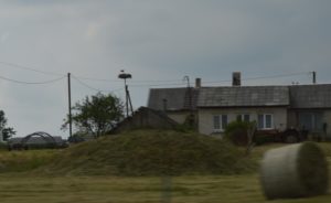 a house with a hill in the background