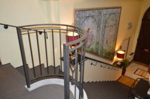 a staircase with a metal railing