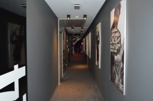 long hallway with pictures on the wall