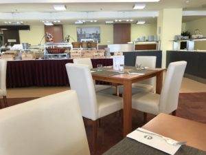 a restaurant with a table and chairs