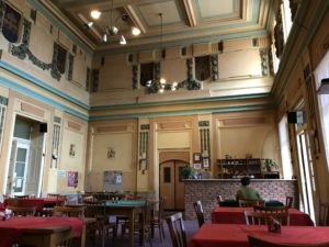 a room with tables and chairs