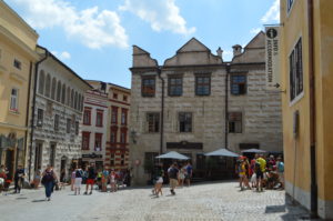a group of people walking in a courtyard
