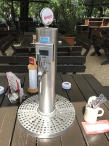 a beer dispenser on a table