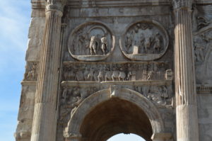 a stone arch with carvings