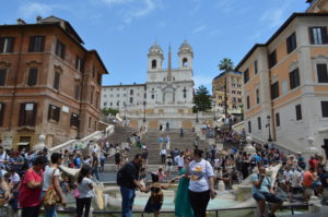 a group of people on stairs with Spanish Steps in the background