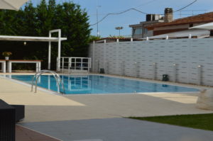 a pool with a white fence