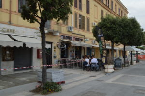 a group of people sitting outside a building