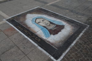 a painting of a woman on the ground