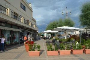 a street with a few people walking