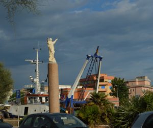 a statue of a man on a pillar