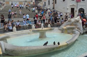 a fountain with birds on it