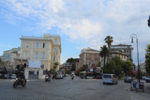 a street with cars and buildings