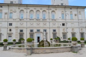 a white building with a fountain