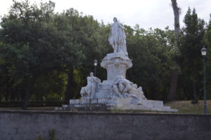 a statue of a woman in a park