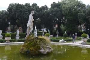 a statue in a pond