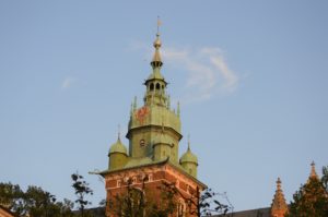 a building with a green tower