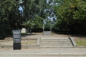 a sign in front of a park