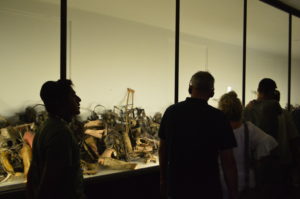 a group of people looking at a display