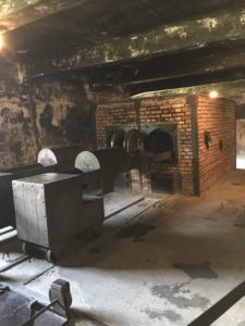 a brick oven with a large metal box