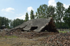 a destroyed building with a broken roof