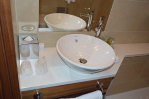 a white sink on a counter