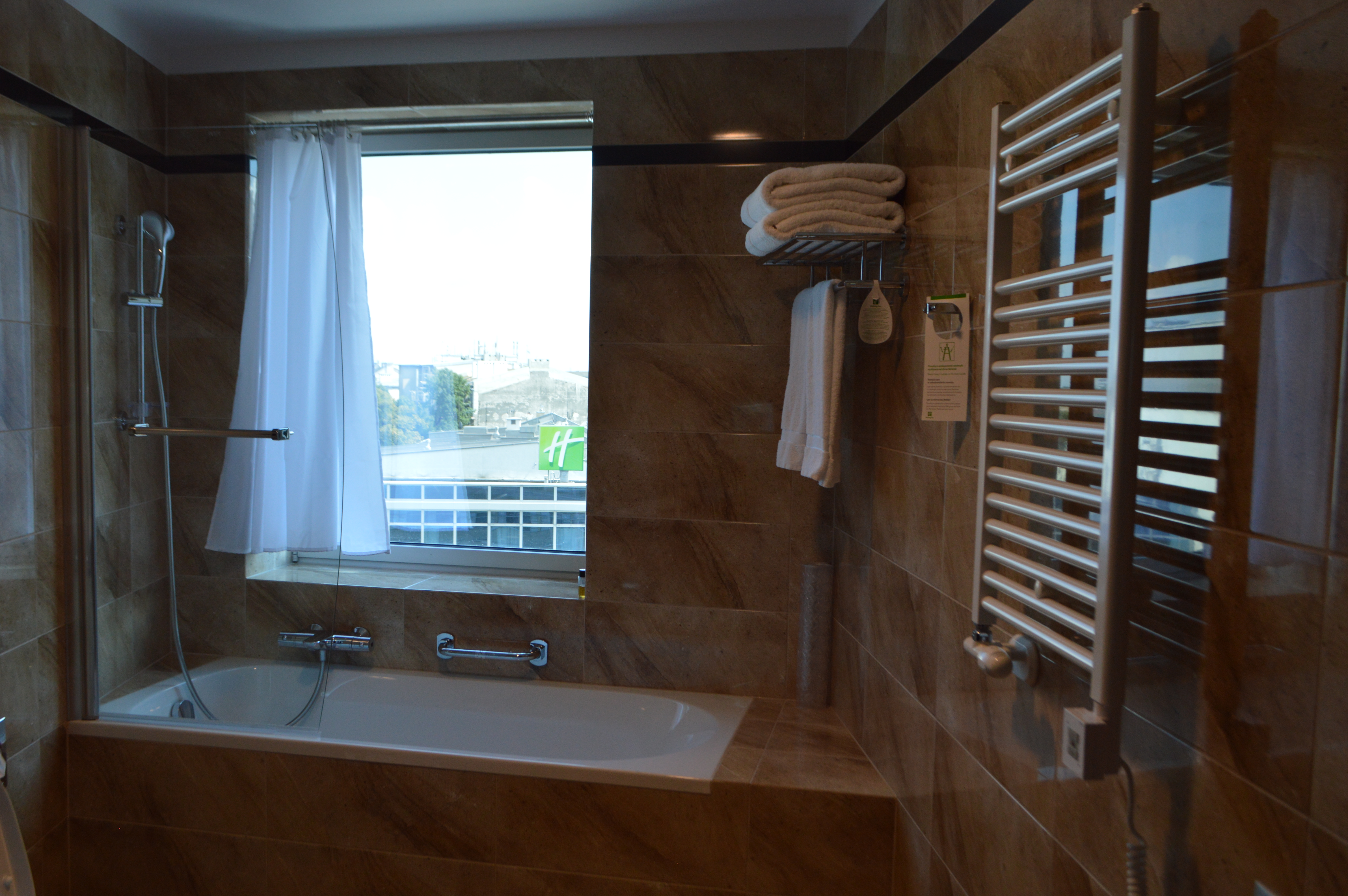 a bathroom with a bathtub and towels