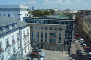 a building with cars parked in front of it