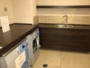 a kitchen with a sink and washer