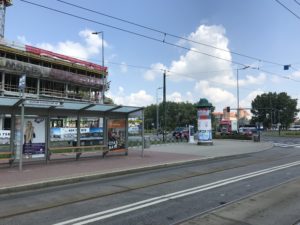 a bus stop with a bus stop and a bus stop