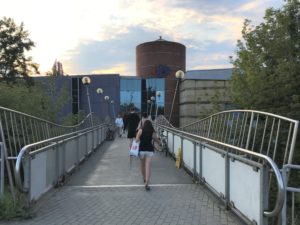 a woman walking on a bridge