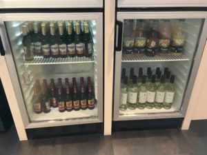 a refrigerator with bottles of alcohol