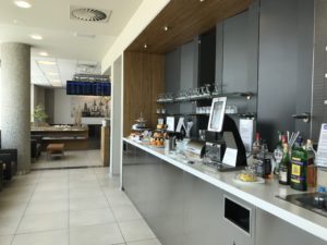 a counter with a variety of beverages on it