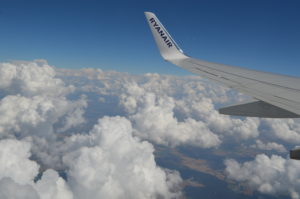 the wing of an airplane above the clouds