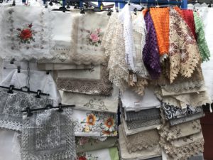 a group of fabric on a rack