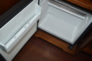 a white refrigerator with a drawer