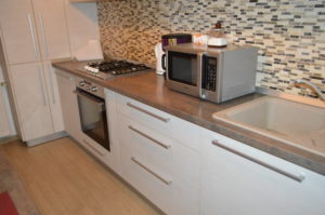 a kitchen with a microwave oven and sink