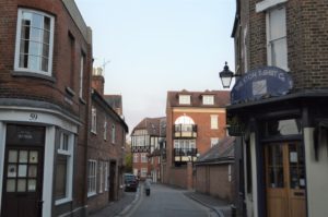 a street with buildings and cars