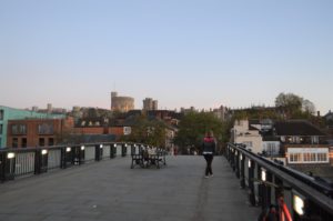 a person standing on a bridge