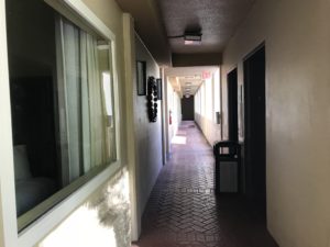 a hallway with a brick floor